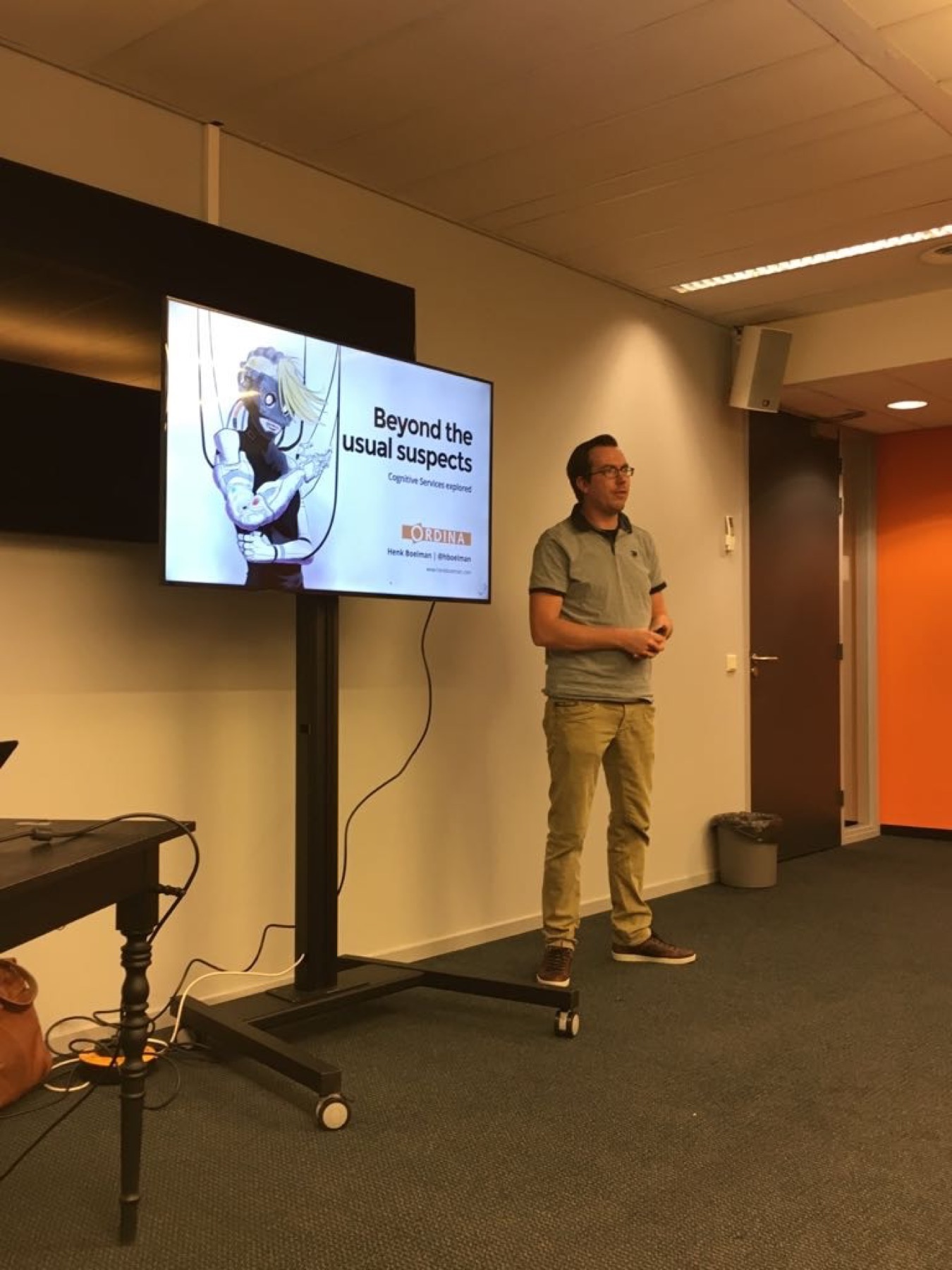 Henk giving an early talk in a small meeting room