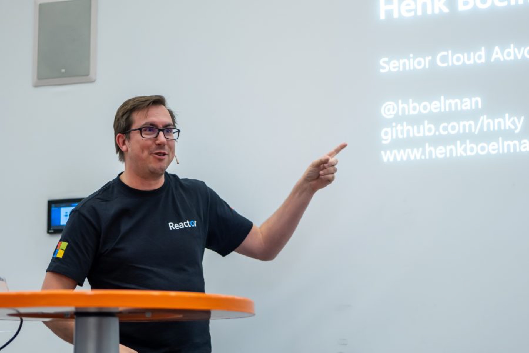 Henk Boelman speaking with a handheld microphone